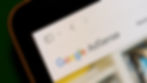 Close up shot of the Google AdSense logo displayed in corner of a computer