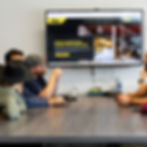 Creative TRND Team at the conference table reviewing a website