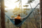 A man sitting in a hammock for a lifestyle photo